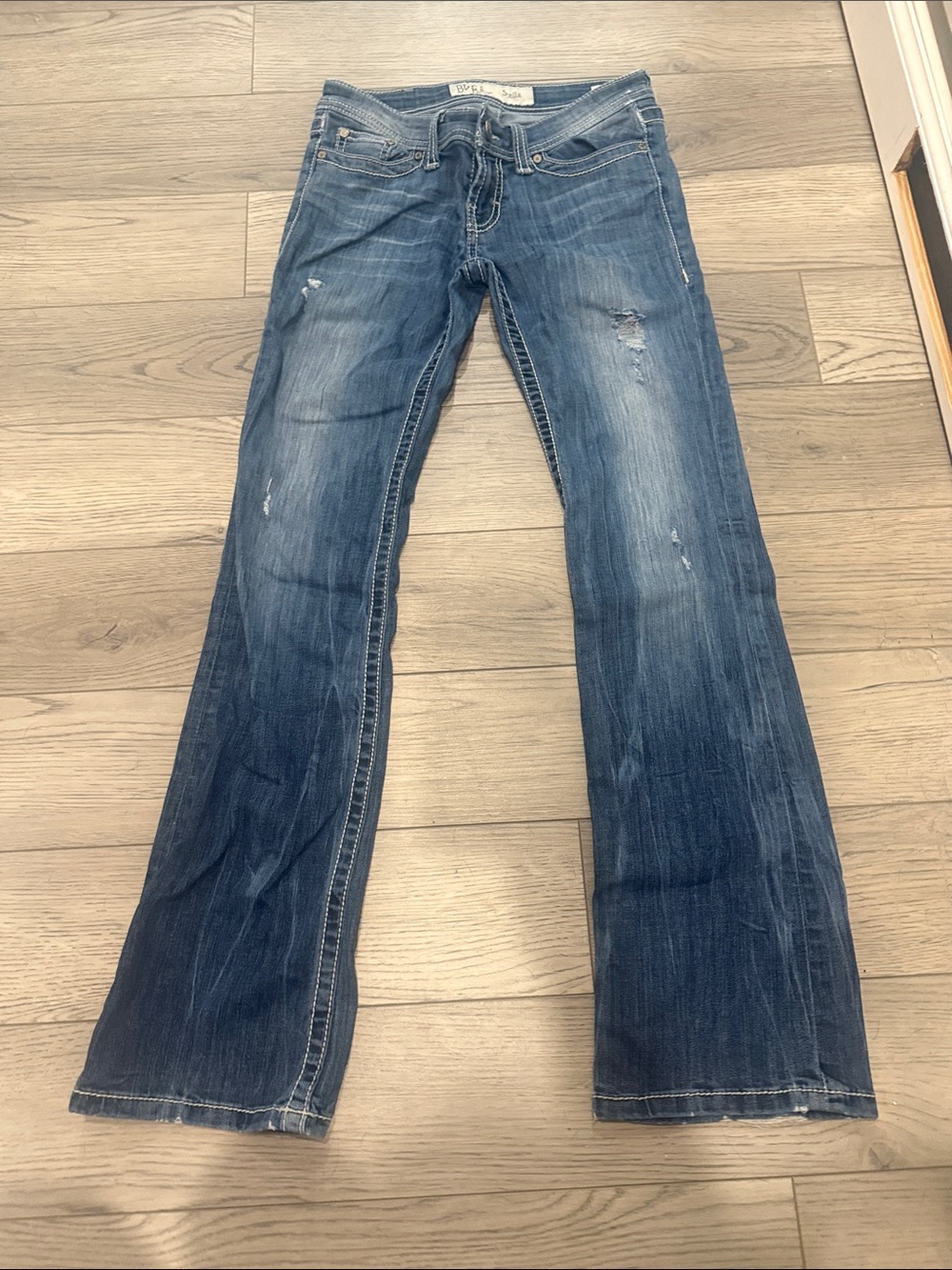Women’s Dark Blue Flared Jeans with Subtle Distressing